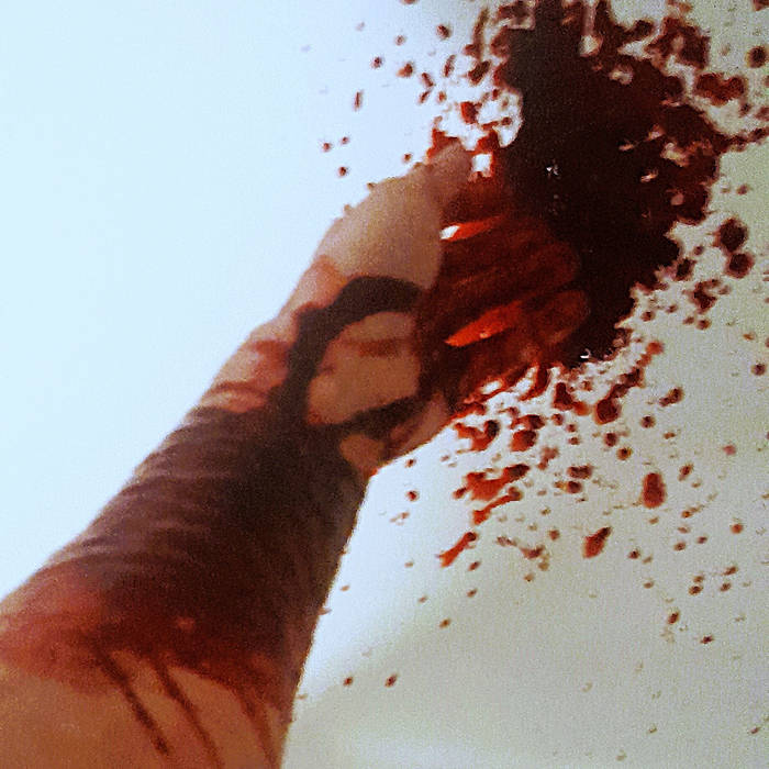 Arm splattered with blood against a white background, evoking a violent, raw aesthetic.